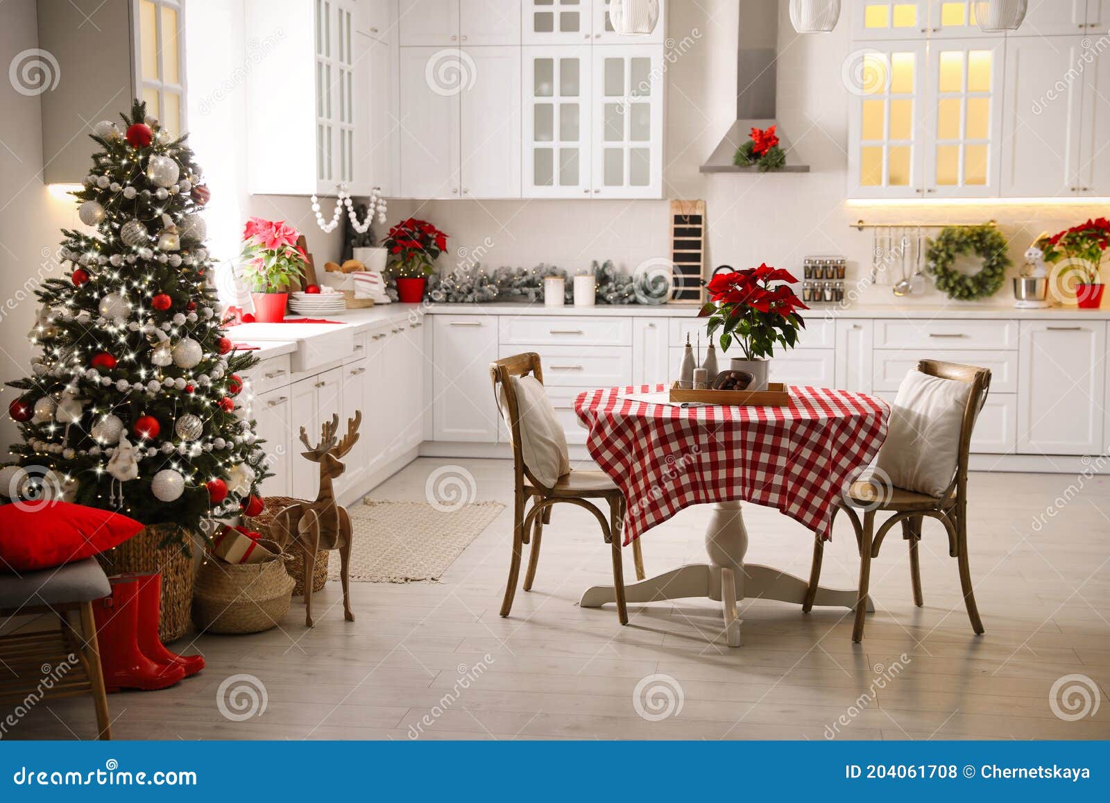 Beautiful Kitchen Interior with Christmas Tree and Festive Decor Stock