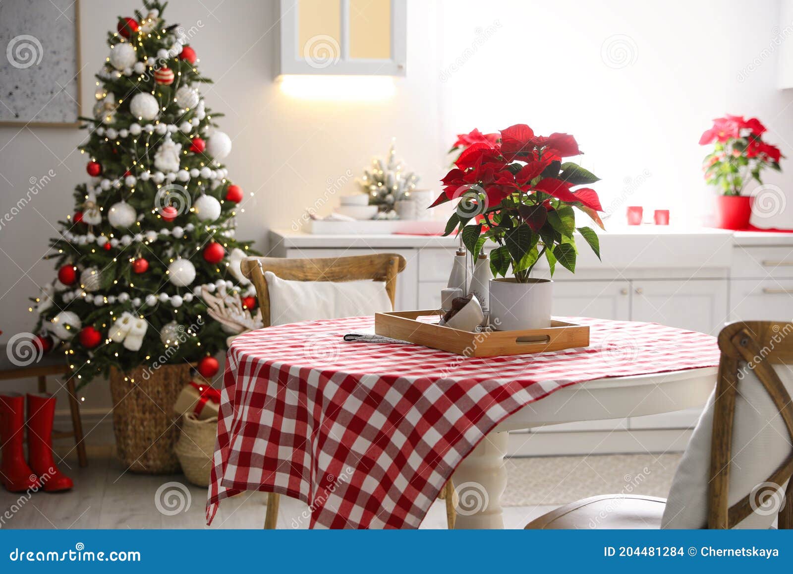 Beautiful Kitchen Interior with Christmas Tree and Festive Decor Stock