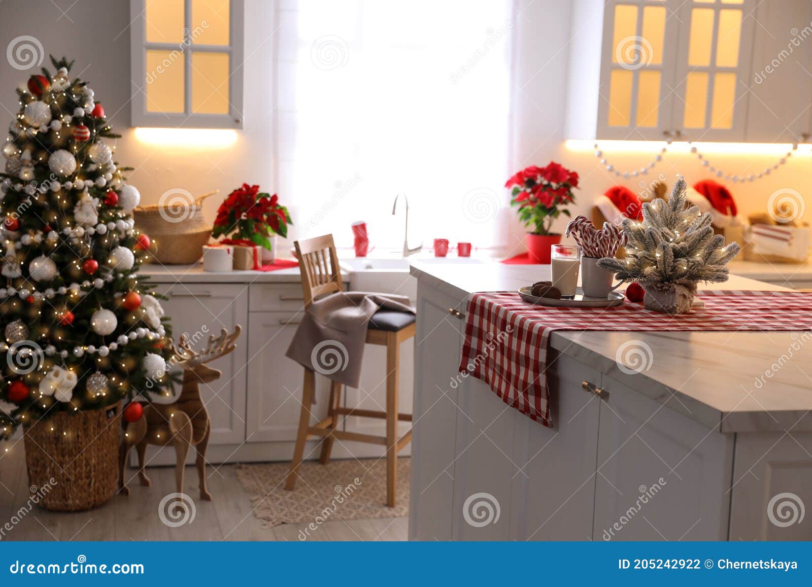 Beautiful Kitchen Interior with Christmas Tree and Festive Decor Stock