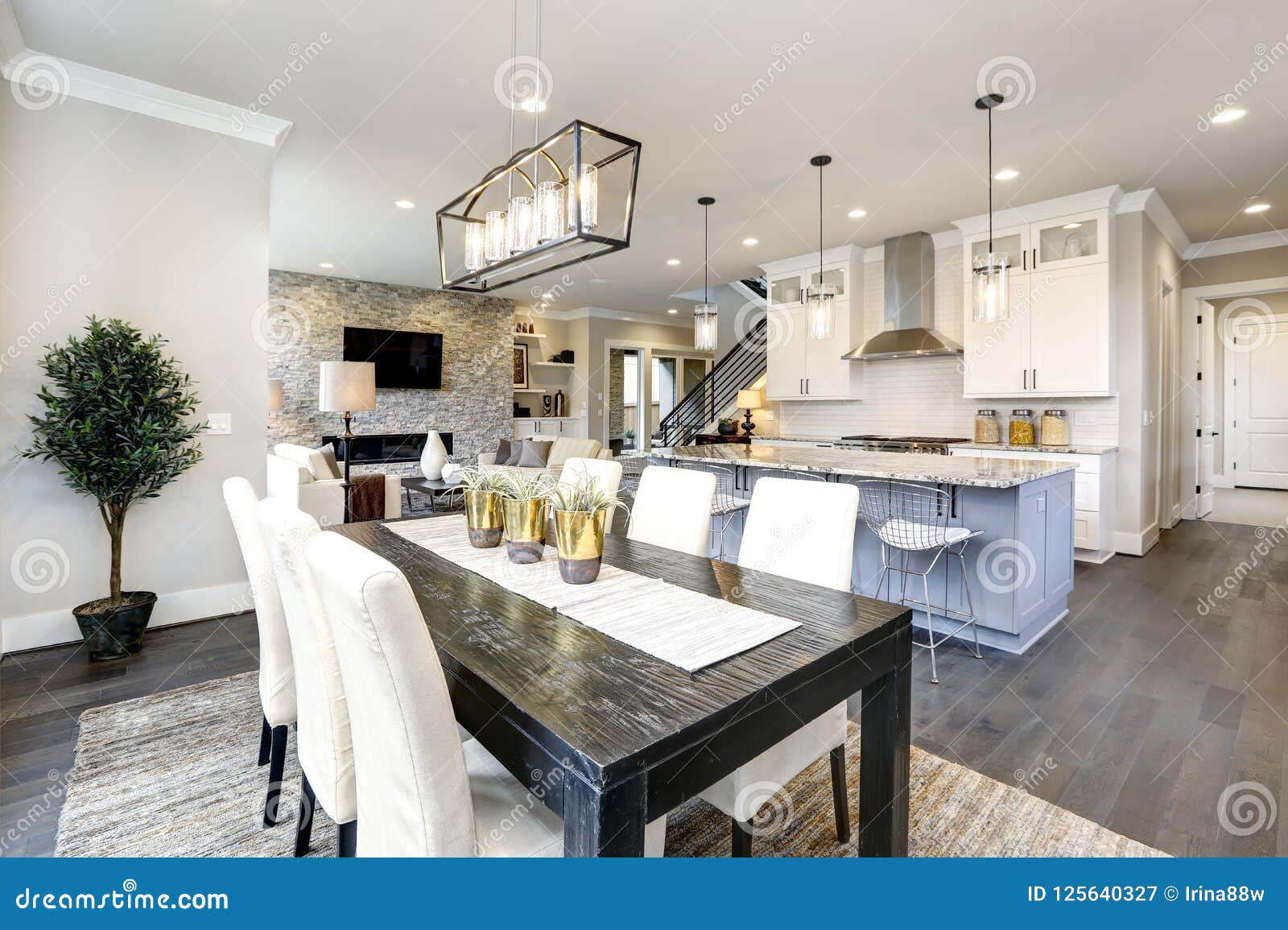 beautiful kitchen in luxury modern contemporary home interior with island and chairs