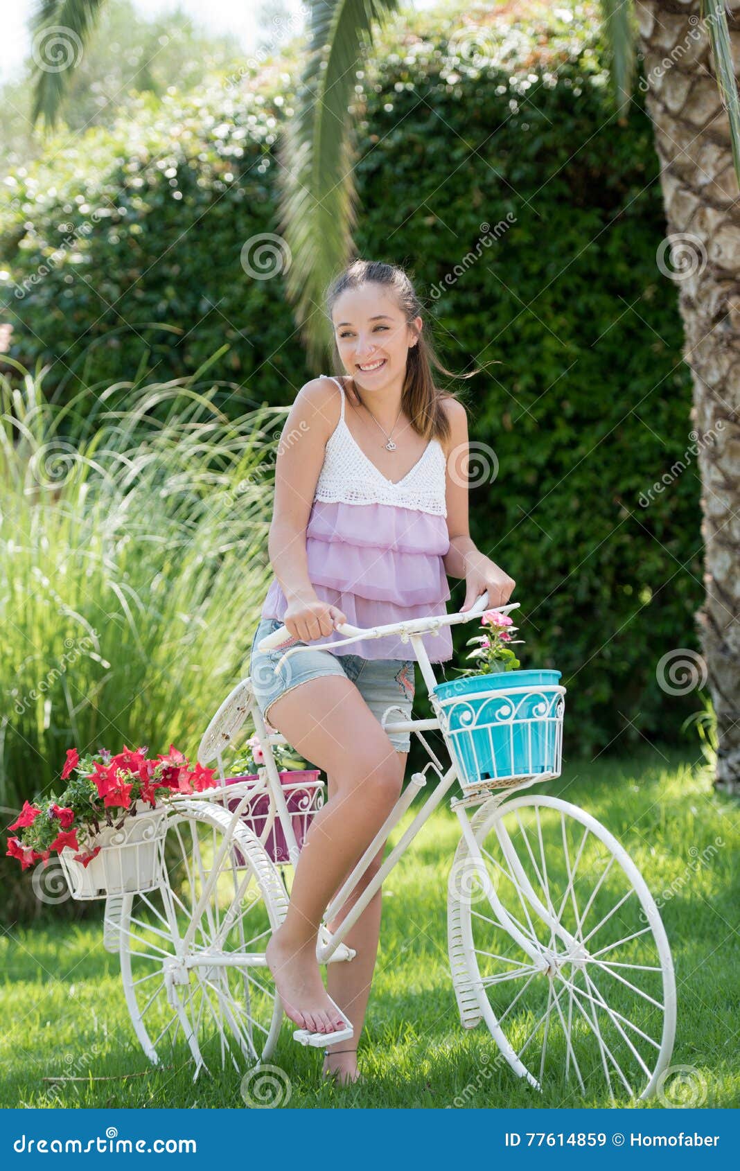 https://thumbs.dreamstime.com/z/beautiful-lady-wear-casual-clothes-leaning-fake-decor-bicycle-ride-flowers-pots-palm-trees-greens-as-background-77614859.jpg