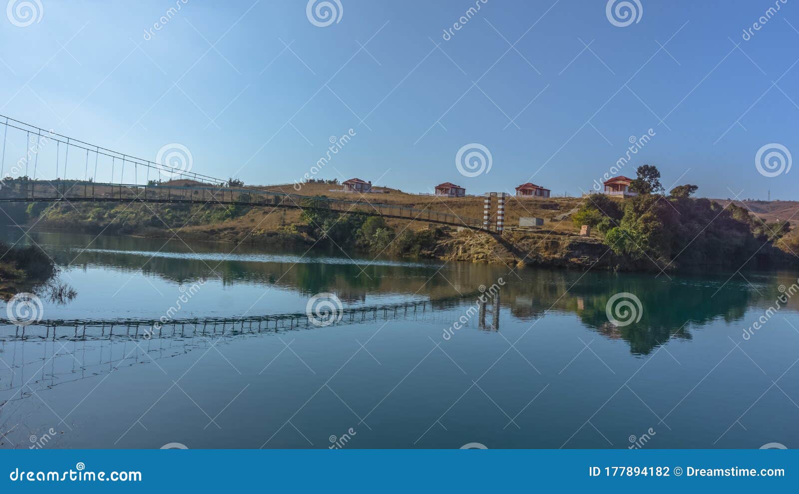 beautiful lake in a country side with a footbridge and resort