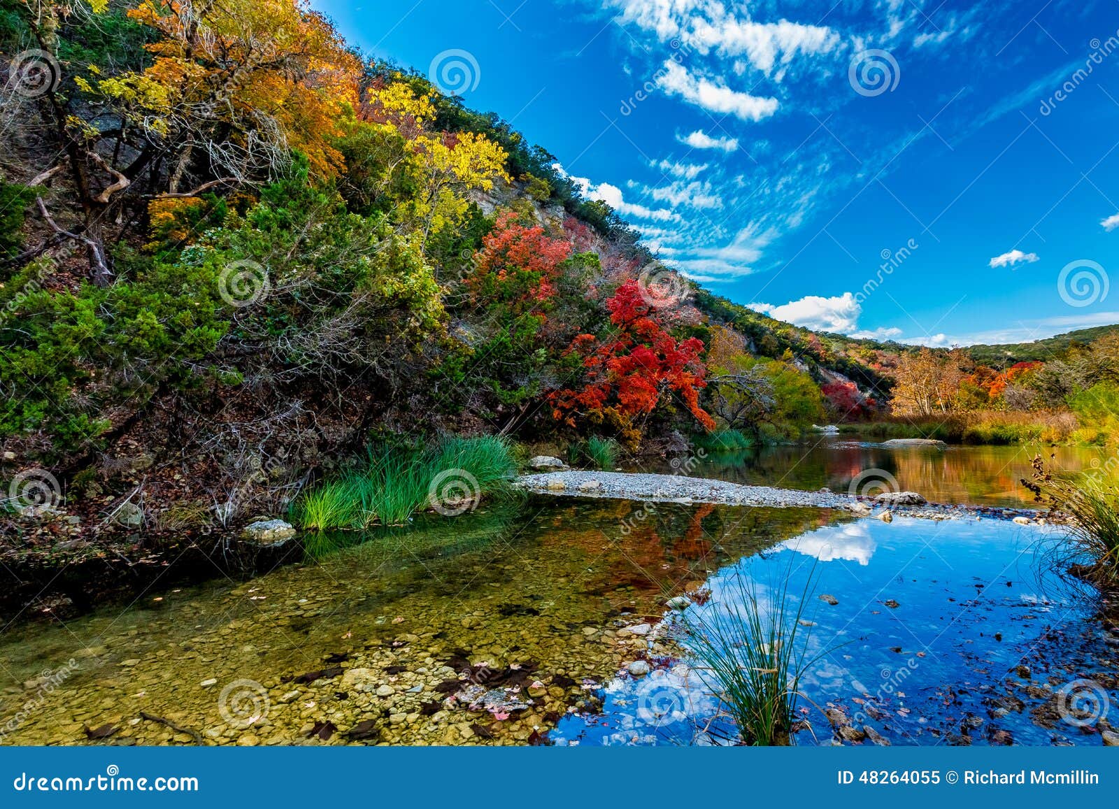 beautiful landscape of fall foliage and clear creek at lost maples state park, texas