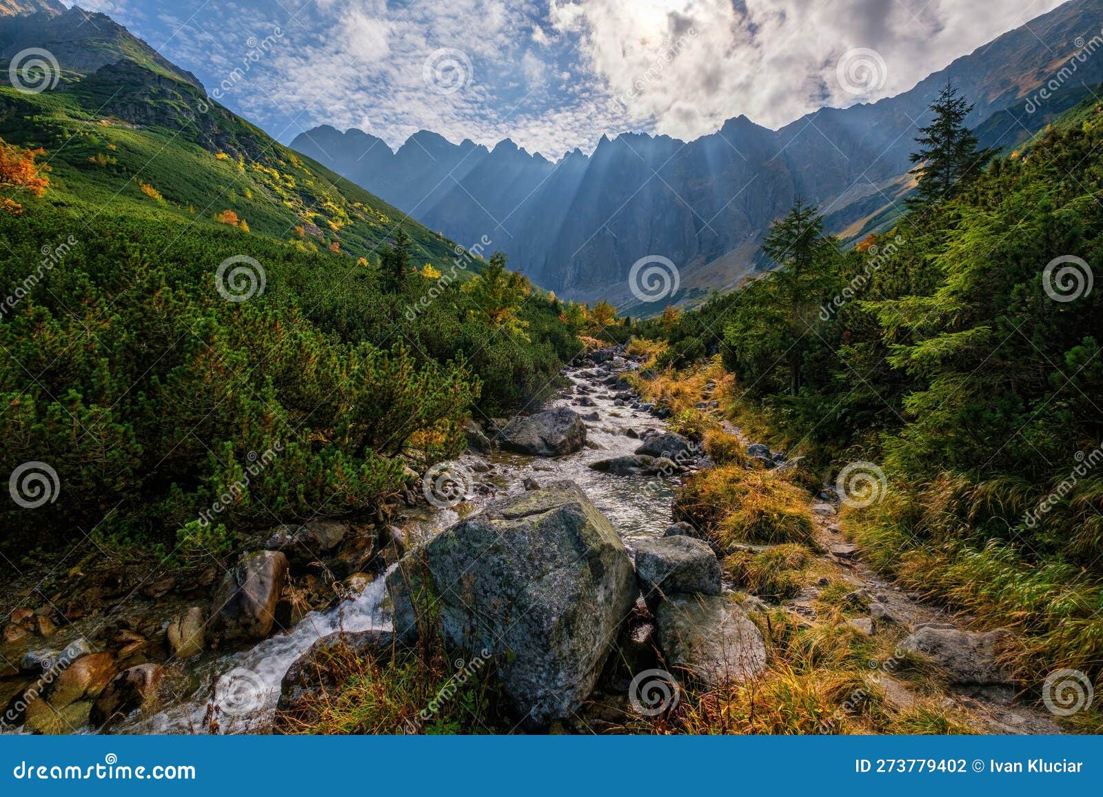 Beautiful Landscape High Mountains Illuminated Peaks Stones Mountain Lake  Reflection Blue Sky Yellow Sunlight Stock Photos - Free & Royalty-Free Stock  Photos from Dreamstime