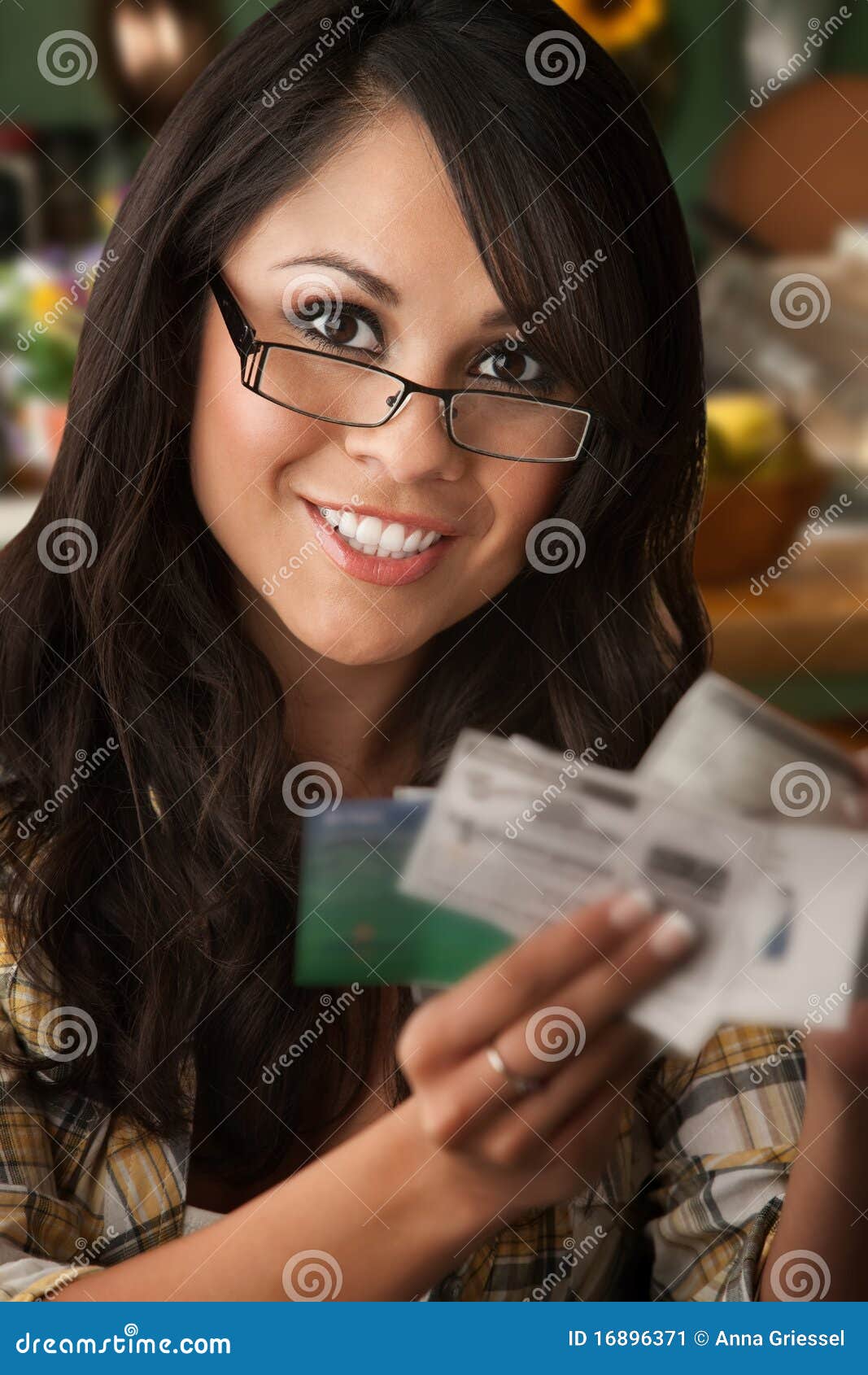 beautiful latina woman with coupons