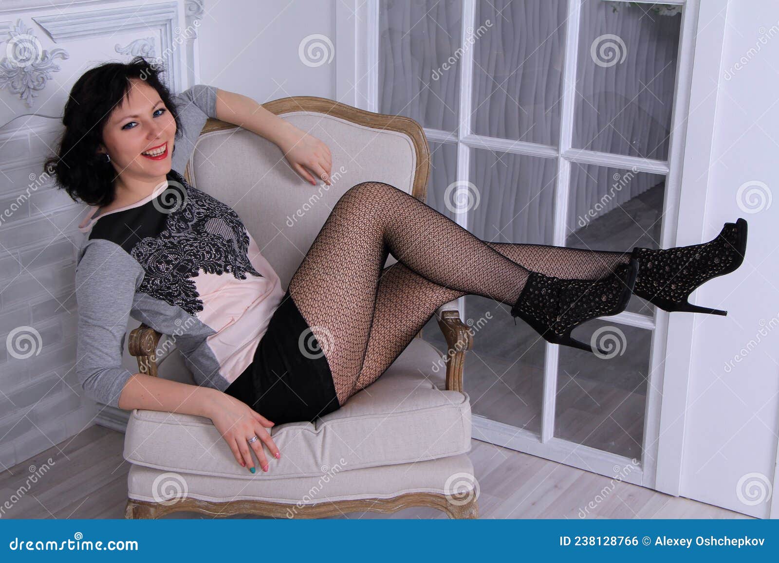 Beautiful Legged Brunette Girl in Black Miniskirt and Black