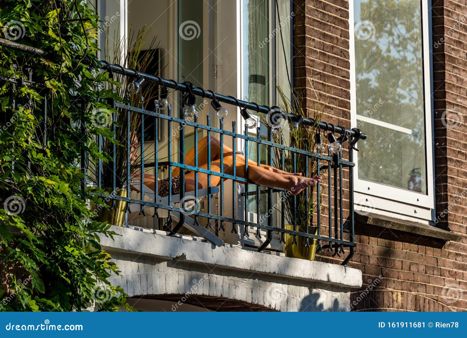 Beautiful Legs On A Sunny French Balcony In The Sun While Sunbathing