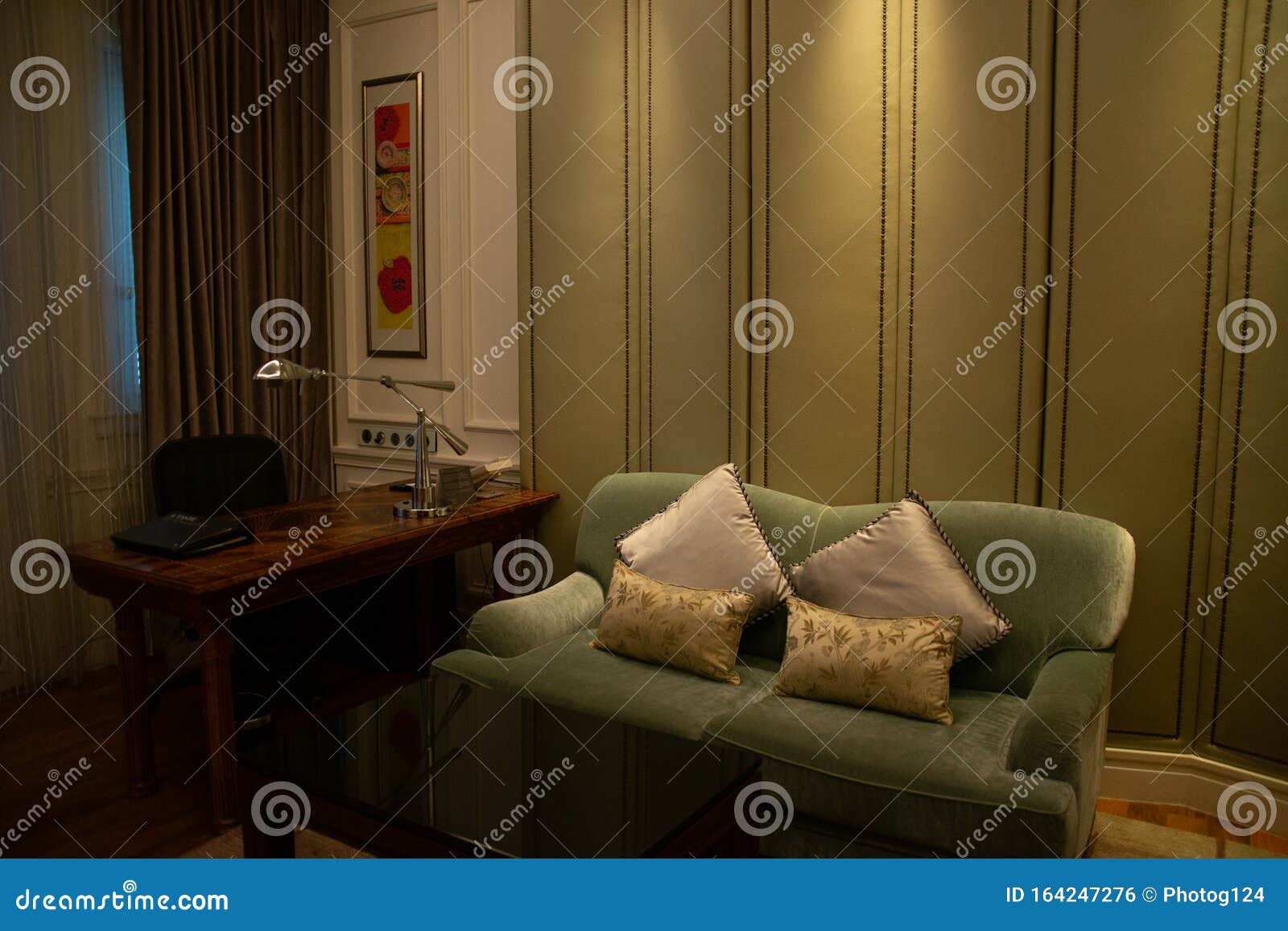 Beautiful Living Room with Couches, Armchairs and Pillows and Lighting