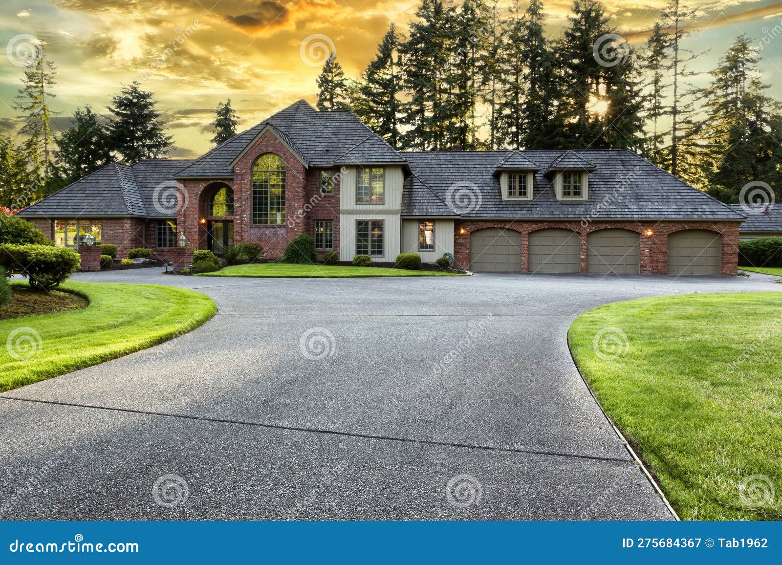 Beautiful Luxury Home Exterior In Early Evening During Golden Sunset