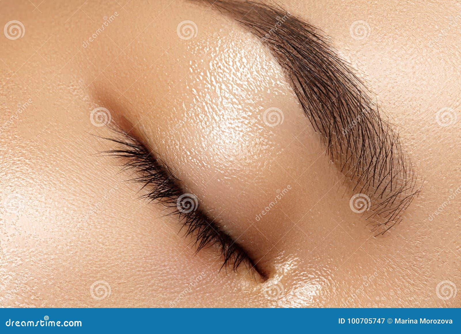 beautiful macro of female eye with clean makeup. perfect  eyebrows. cosmetics and make-up. care about eyes