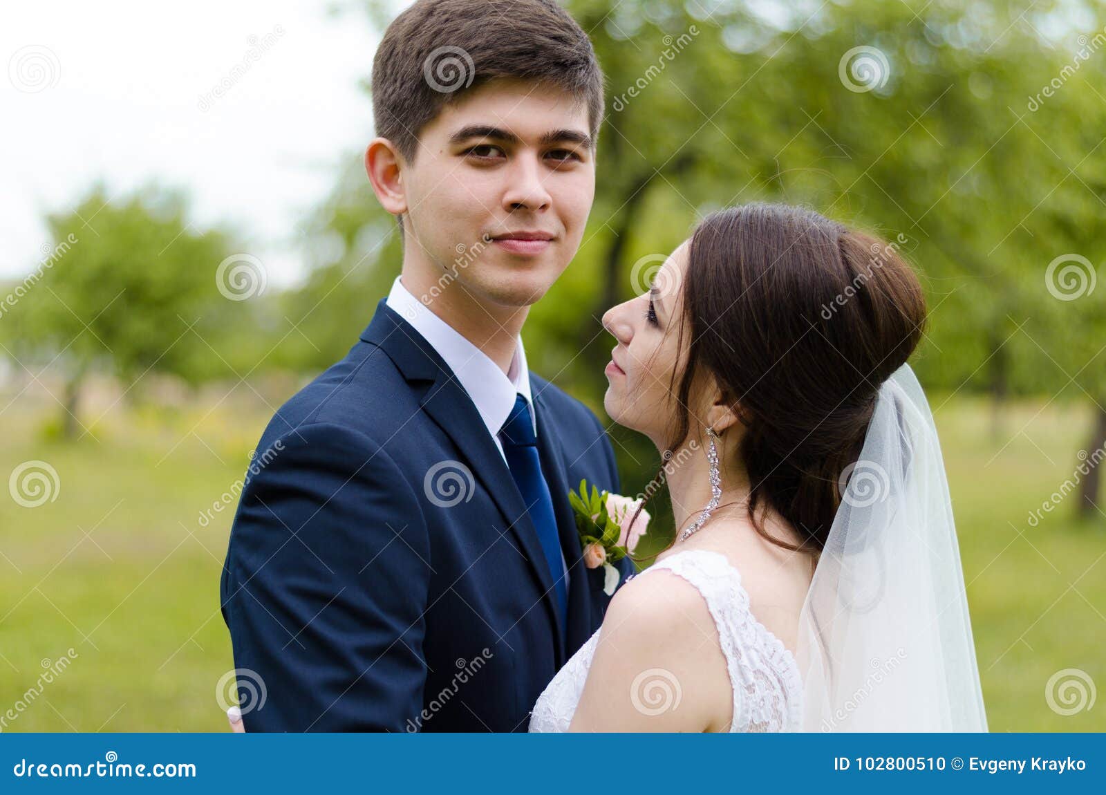 A Beautiful Married Couple in Wedding Dresses, Posing for a Photo Shooting  in an Belarusian Village. Green Background Stock Photo - Image of happy,  couple: 102800510