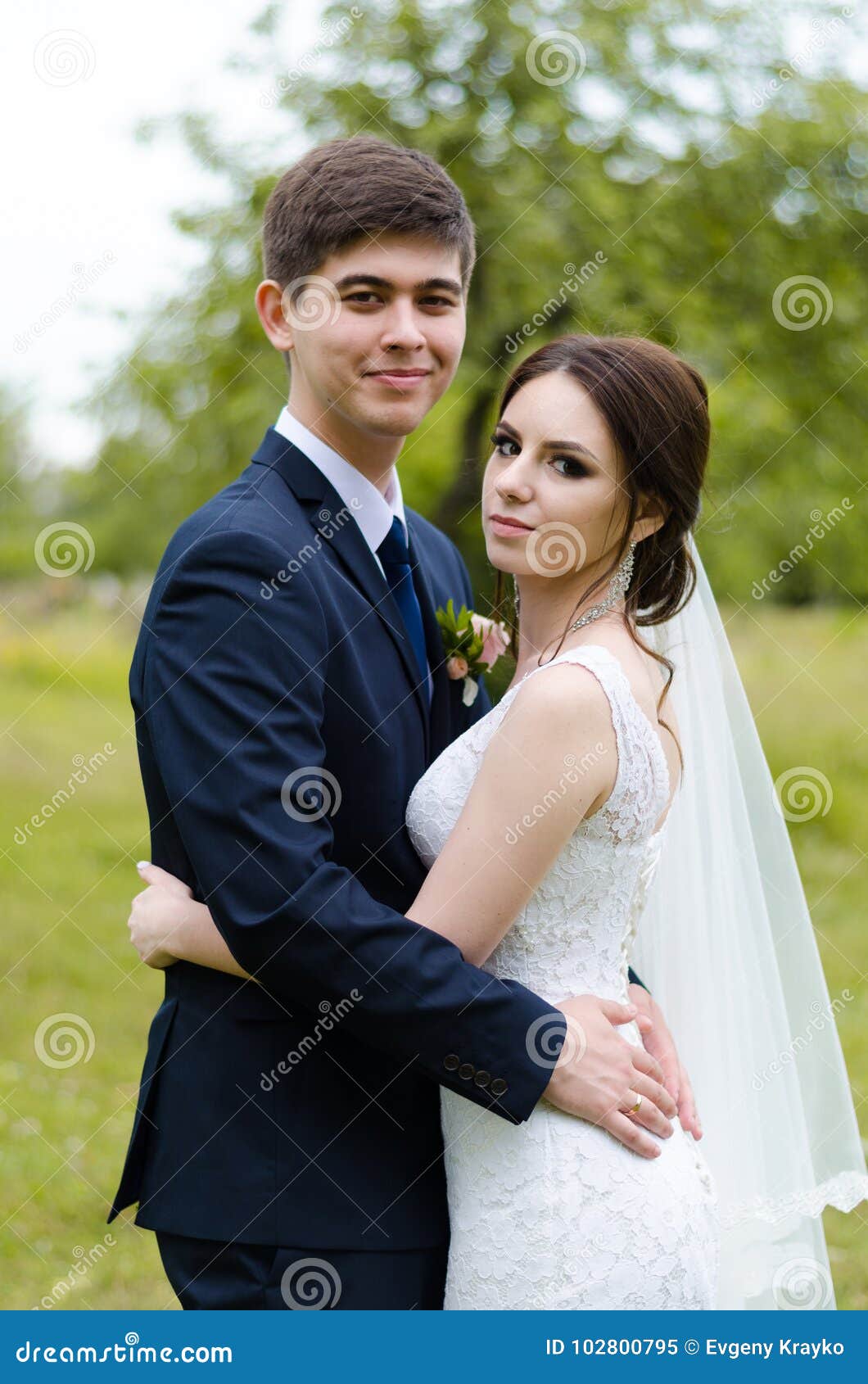 A Beautiful Married Couple In Wedding Dresses Posing For A Photo