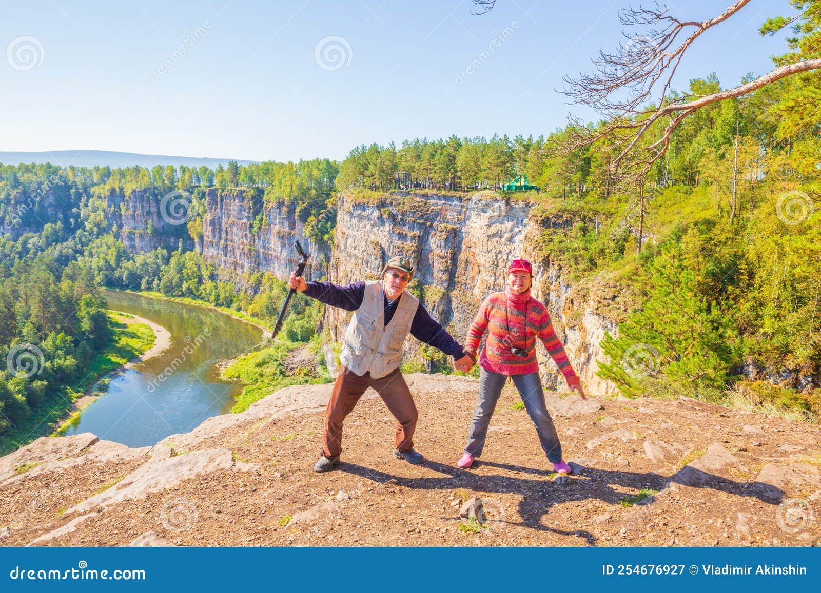 A Beautiful Mature Couple On A High Rock Admires The Ural Nature And The Ai River Stock Image