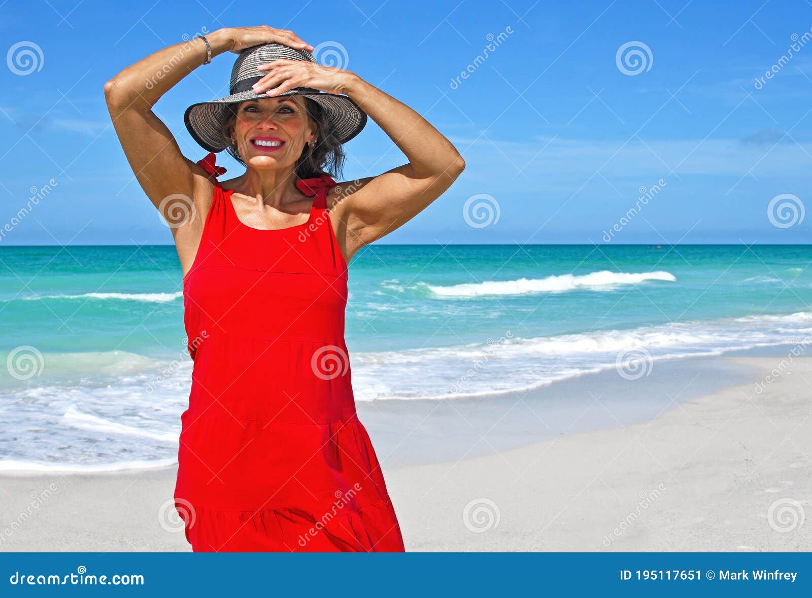 Beautiful Mature Woman On Beach Wearing A Red Dress Stock Image Image Of Gulf Island 195117651