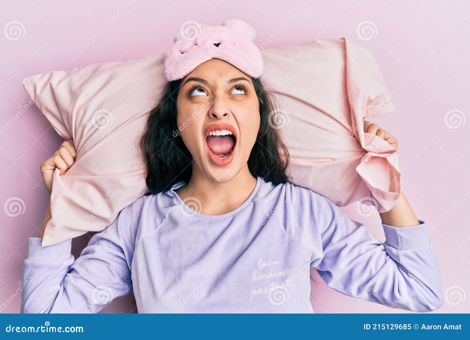 Beautiful Middle Eastern Woman Wearing Sleep Mask And Pajama Sleeping On Pillow Angry And Mad