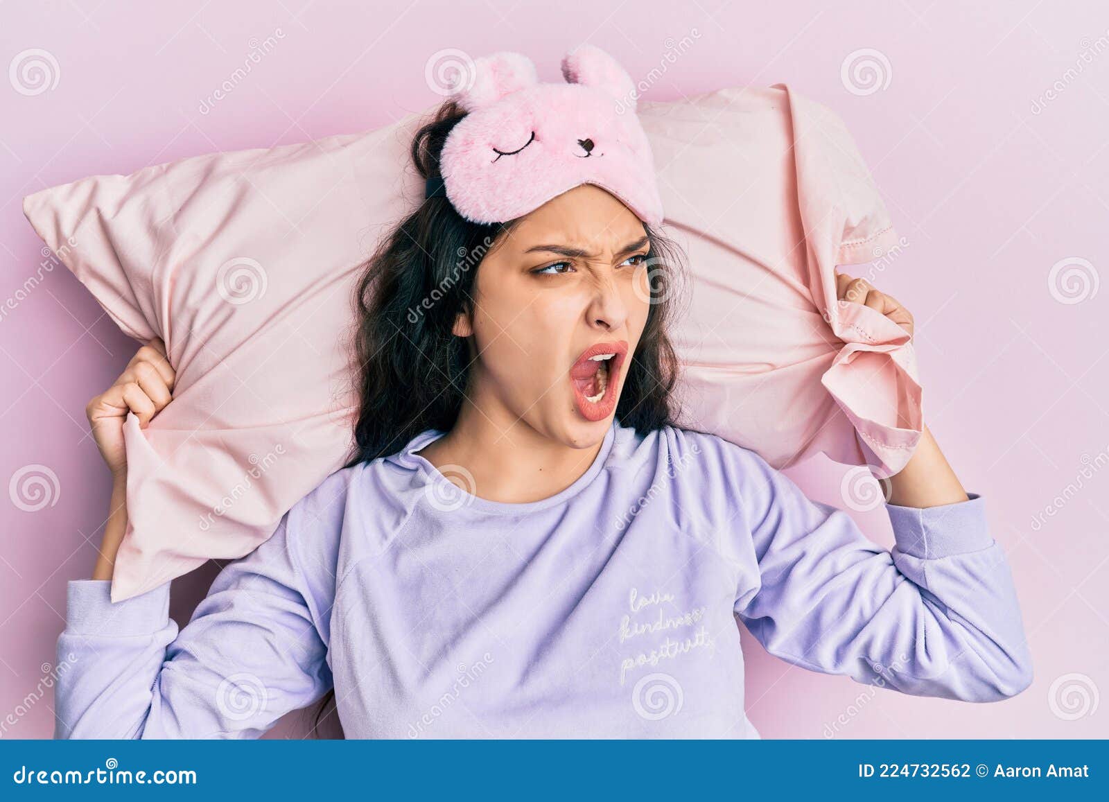 Beautiful Middle Eastern Woman Wearing Sleep Mask And Pajama Sleeping On Pillow Angry And Mad