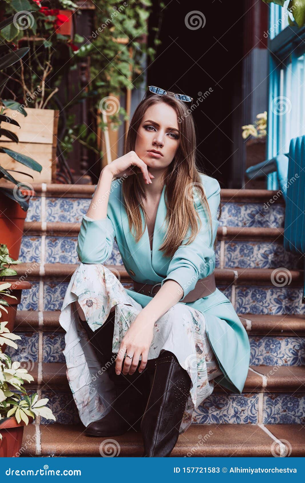 Beautiful Model with Blond Hair Sitting on the Stairs. Skin Retouching ...