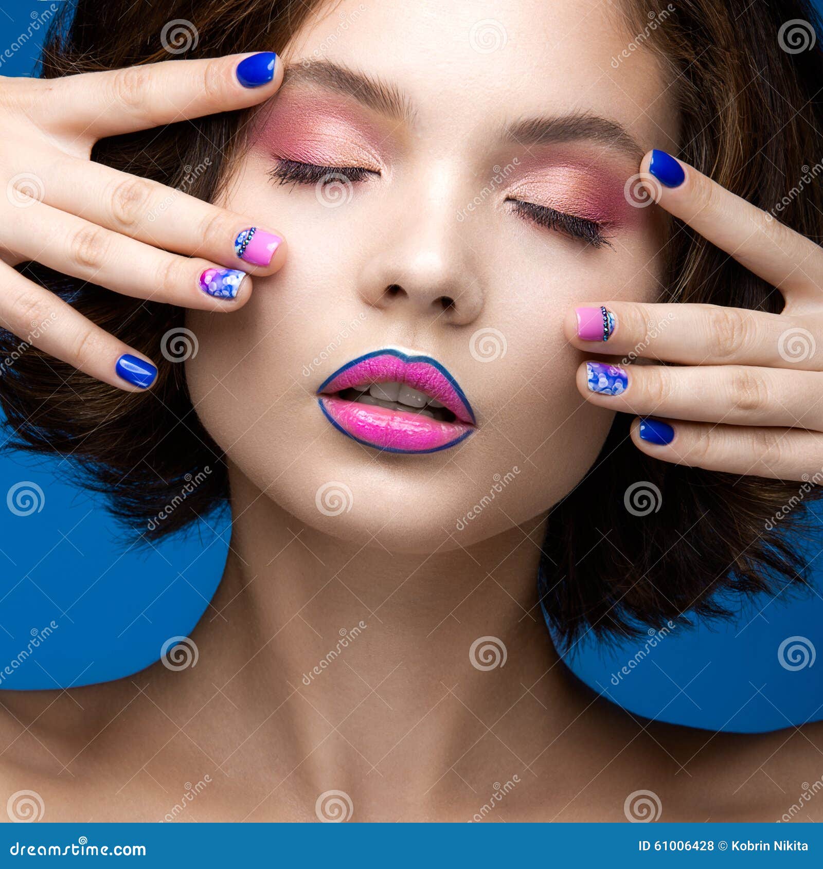 Beautiful Model Girl With Bright Makeup And Colored Nail