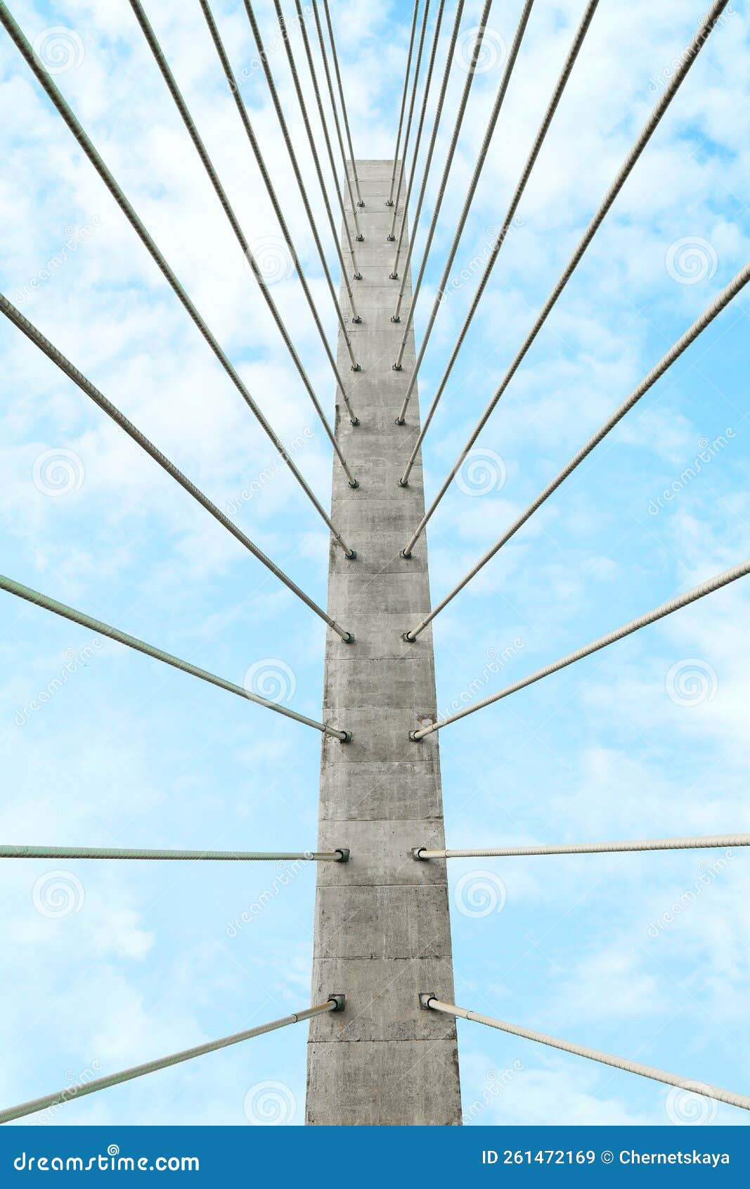 beautiful modern bridge against blue cloudy sky, low angle view