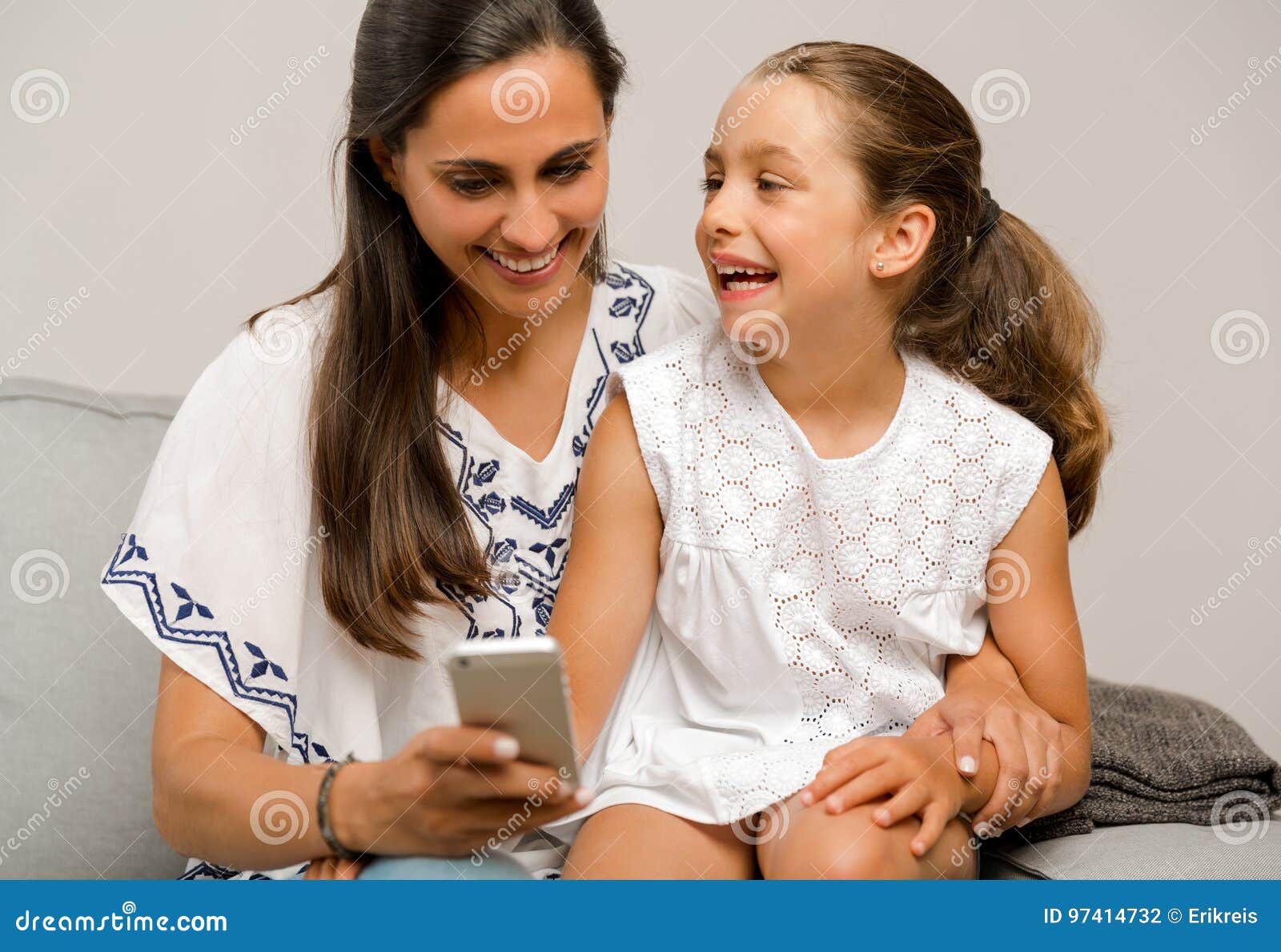 Mother and Daughter at Home Stock Photo - Image of cellular, cheerful ...