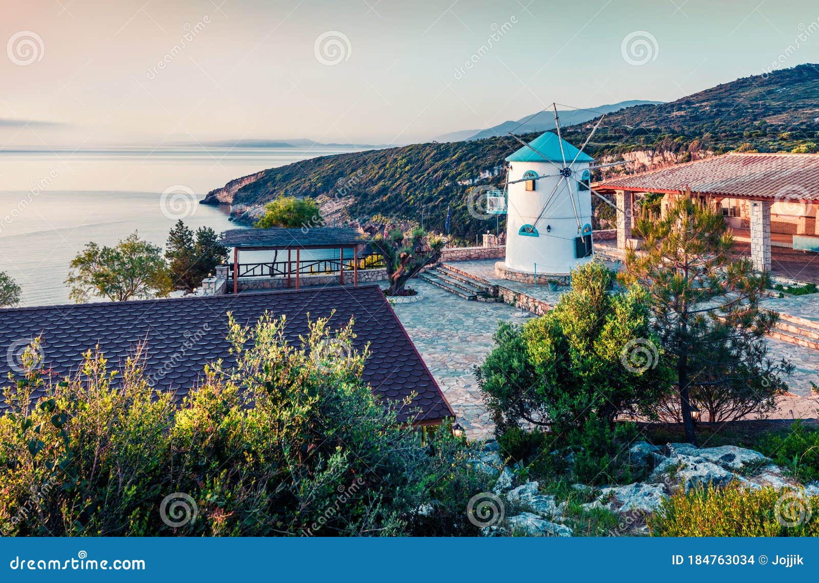 beautiful morning view of potamitis windmill. bright spring scene of zakynthos island, korithi location, ionian sea, greece,