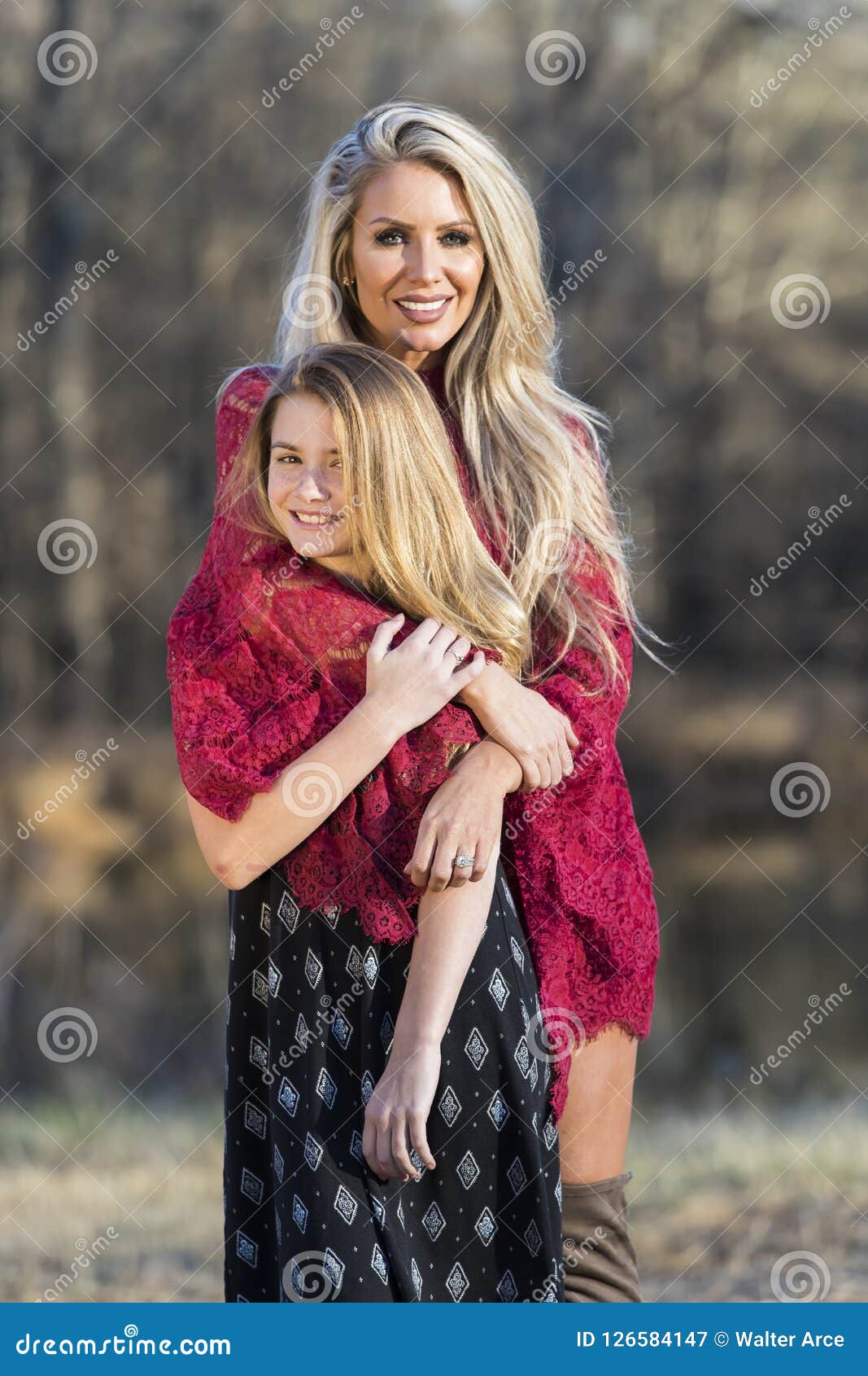 Gorgeous Blonde Model Posing With Her Teenage Daughter 