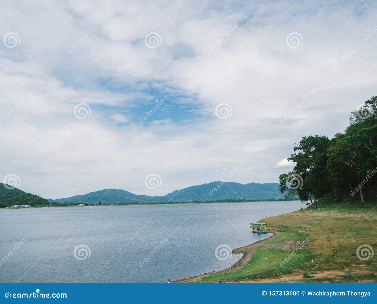 beautiful mountain, blue sky and water viewpoint of bang pra reservoir, thailand. it`s one of famous tourist attraction and great