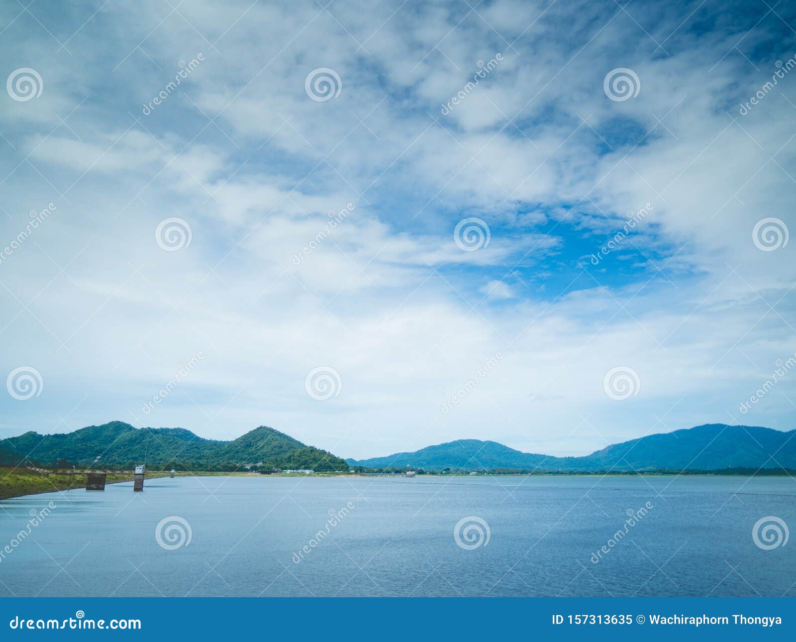 beautiful mountain, blue sky and water viewpoint of bang pra reservoir, thailand. it`s one of famous tourist attraction and great