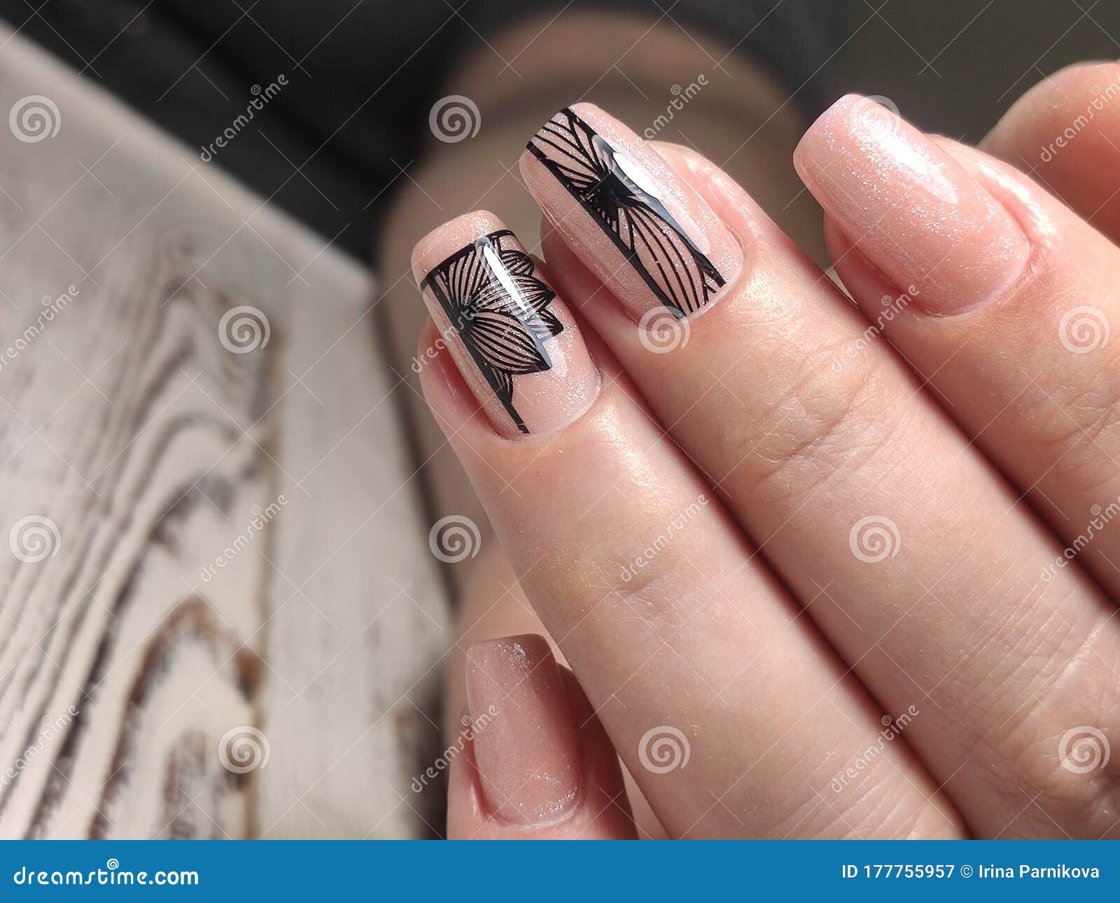 Fashionable design of manicure on beautiful pens Stock Photo by  ©SmirMaxStock 317493212