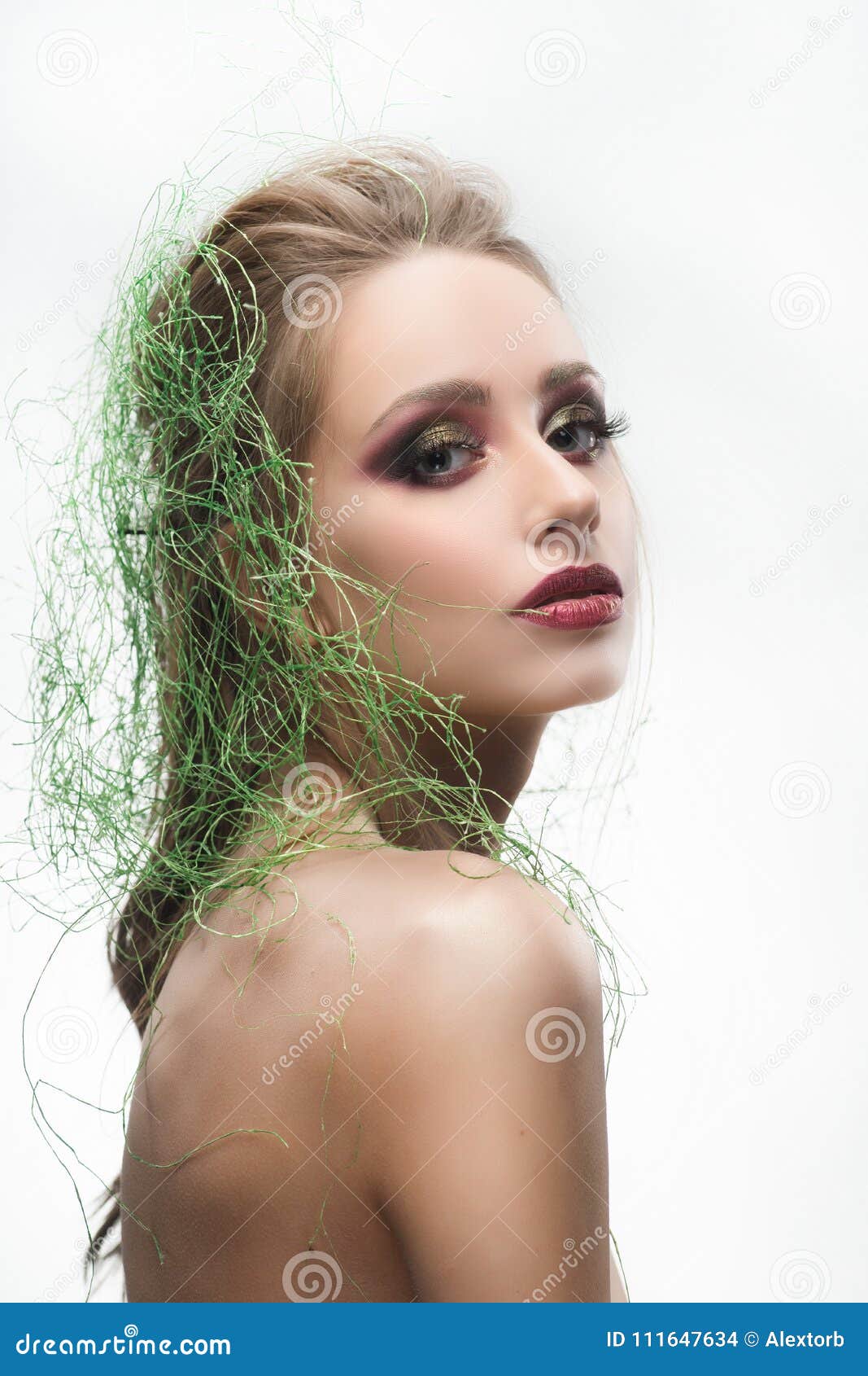 Beautiful naked young woman with her hair transforming in 