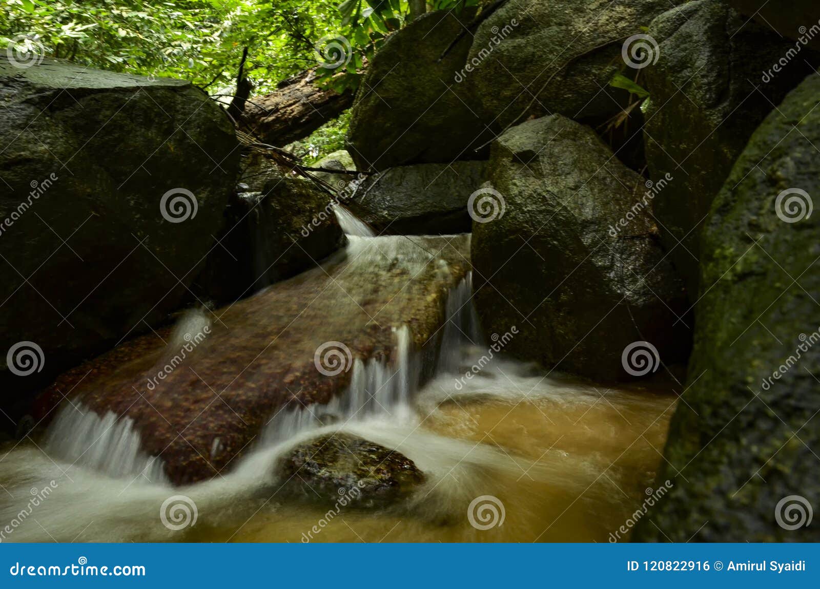 Beautiful In Nature Cascading Tropical River Wet And Mossy Rock Stock