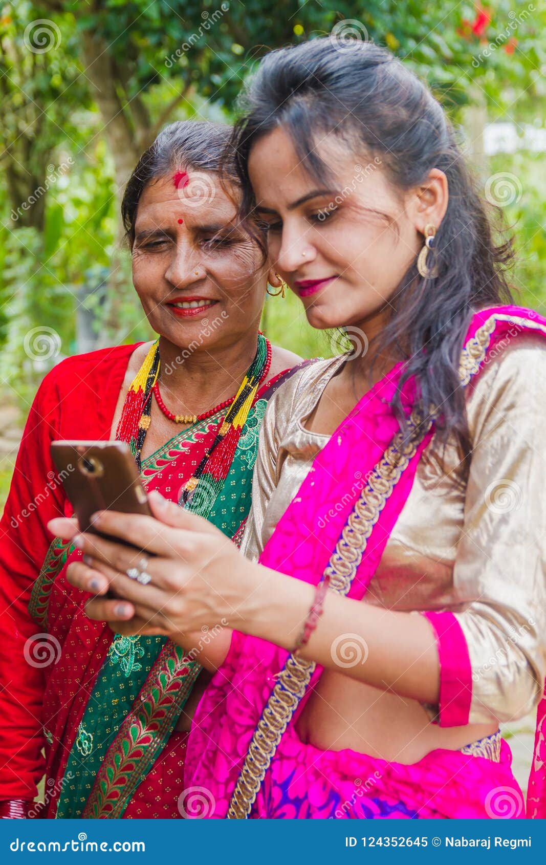 Beautiful Nepali Girl Showing Photo To Her Mother In Smartphone Editorial  Image - Image of nature, nepal: 124352645