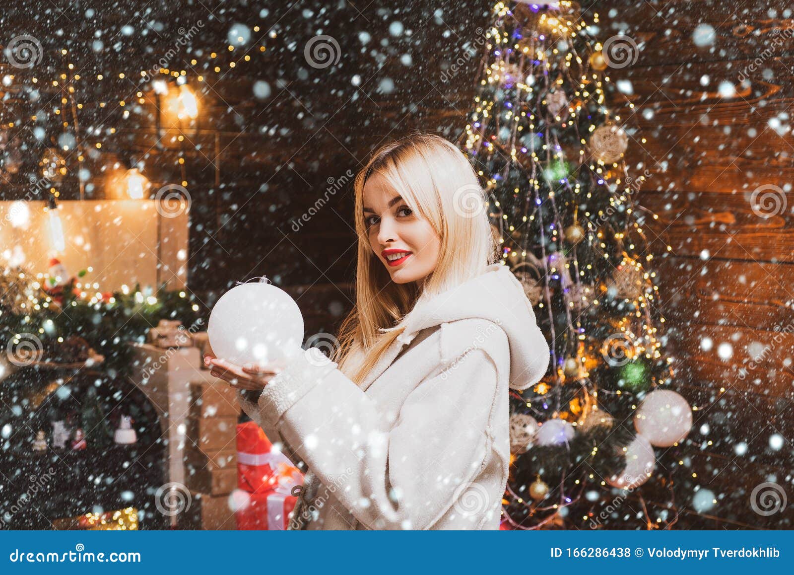 Woman in Snow. Beautiful New Year and Christmas Scene. Young Woman in ...