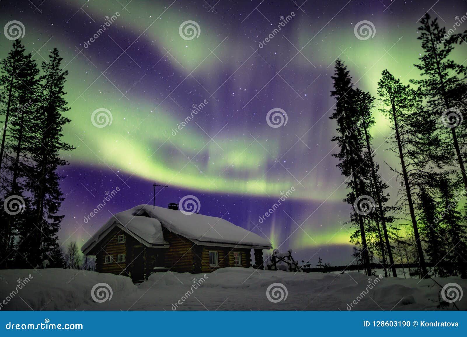 beautiful northern lights aurora borealis in the night sky over winter lapland landscape, finland, scandinavia