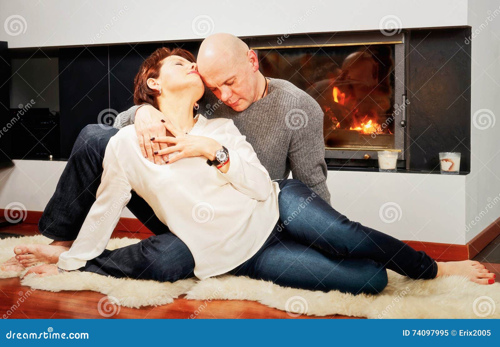 Couple Makes Passionate Love By The Fireplace