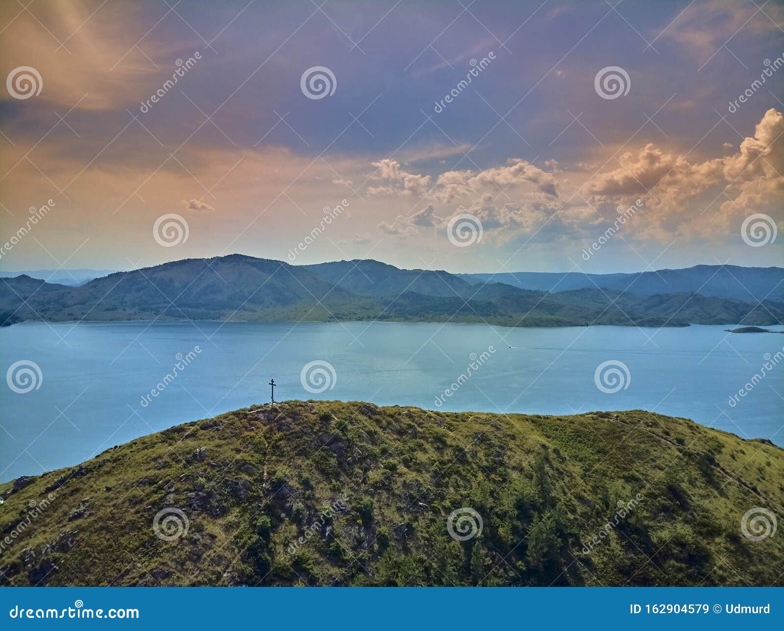 beautiful panoramic aerial summer view at sunset to the bukhtarma artificial reservoir, formed by the dam of the bukhtarma