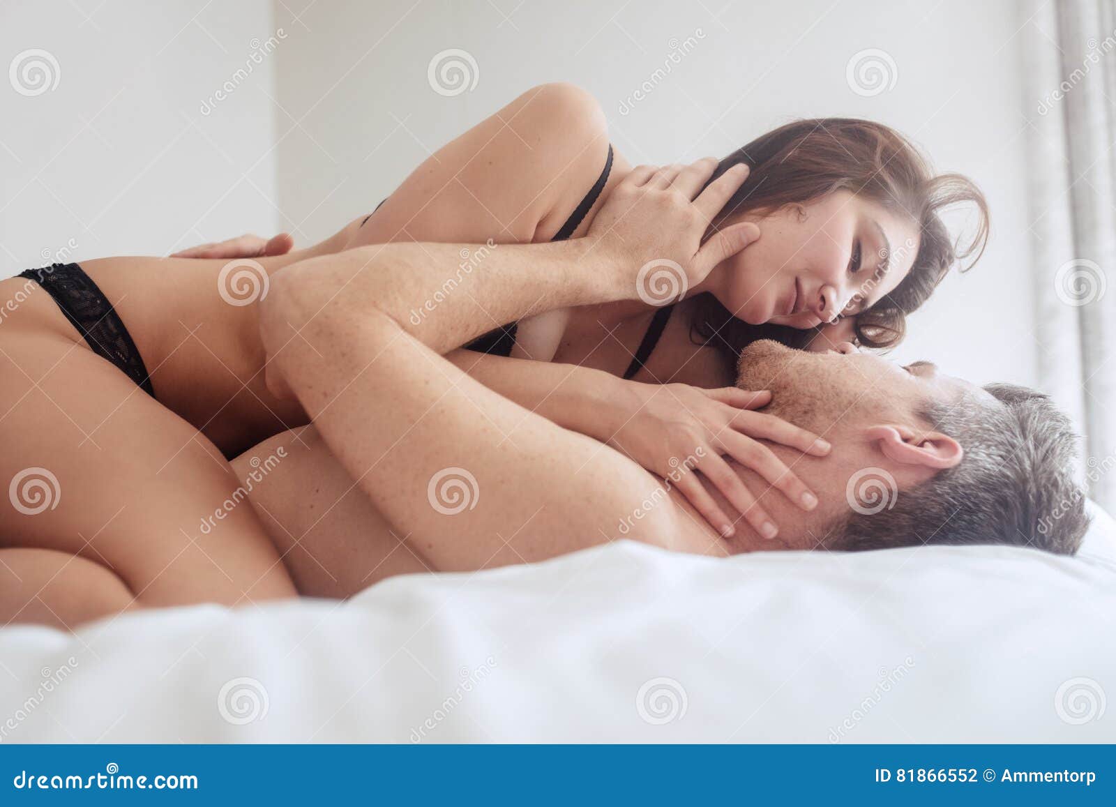 Beautiful Passionate Couple Having Sex on Bed Stock Photo photo