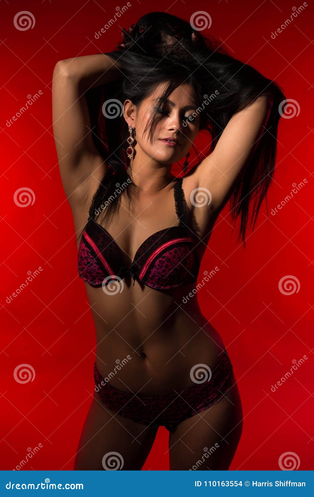 Filipina in red and black. Beautiful petite Filipino woman in red and black lingerie