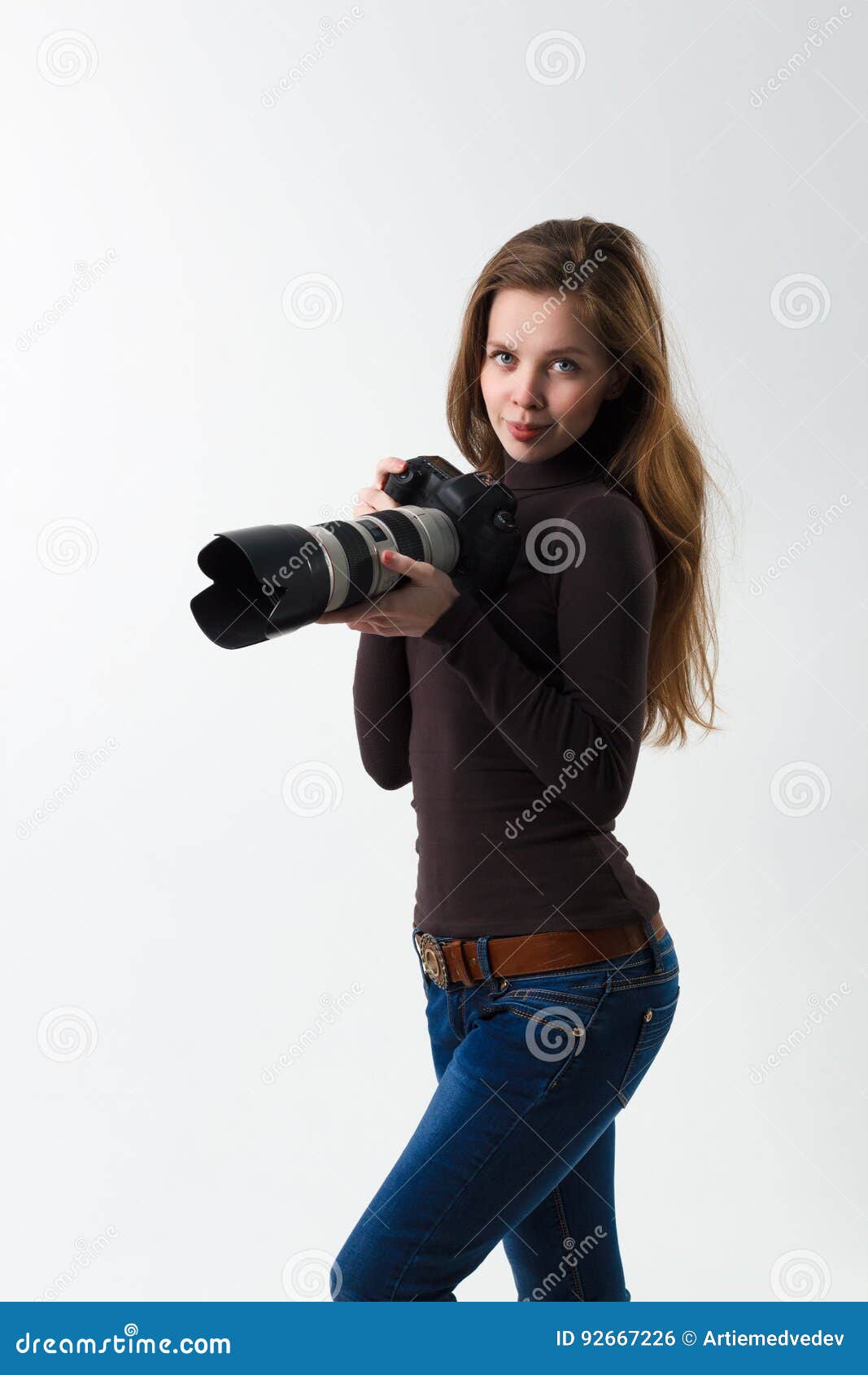 Man photographer with a DSLR camera in her hands posing - stock photo  3190149 | Crushpixel
