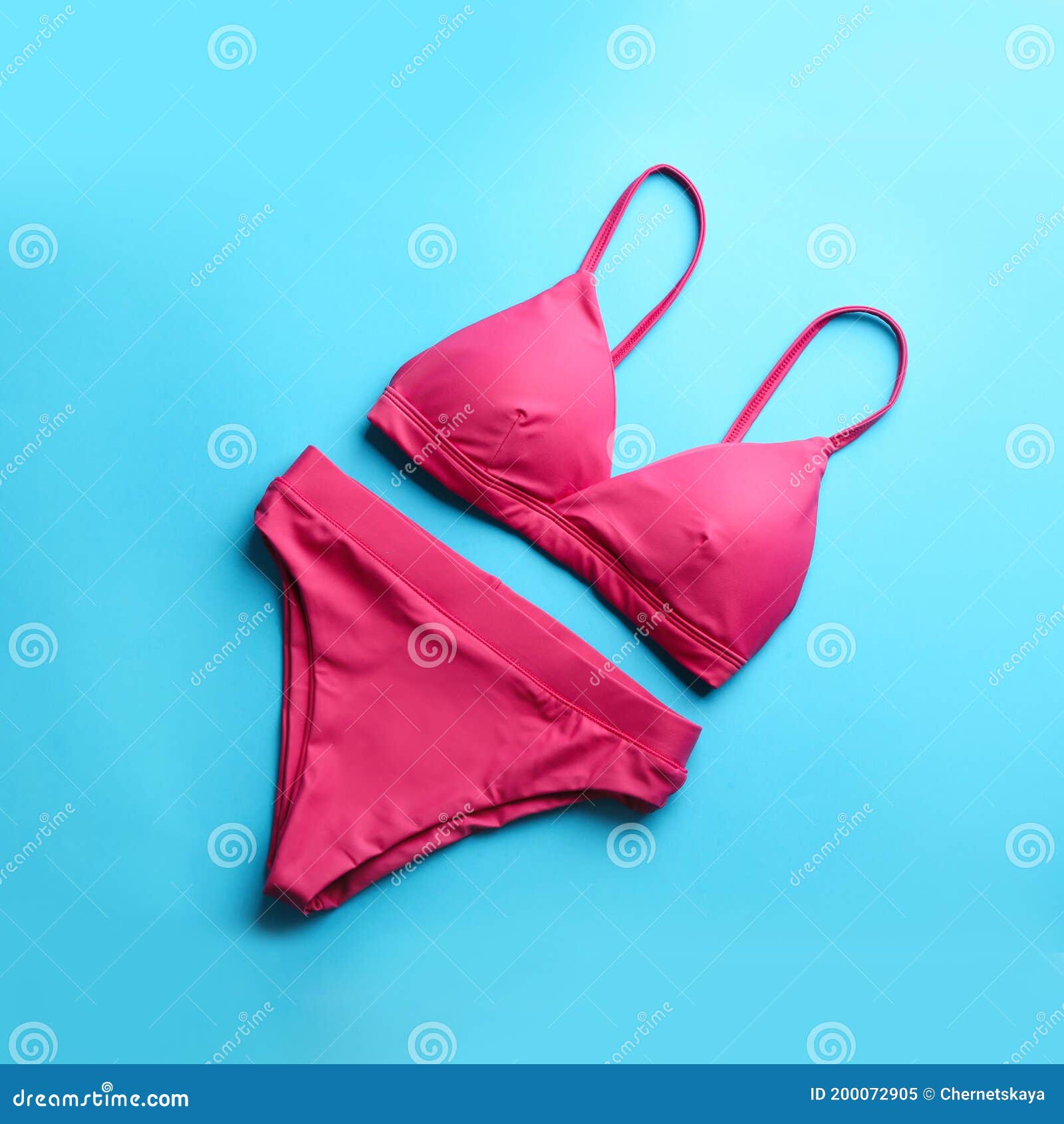 Beautiful Pink Bikini on Light Blue Background, Top View Stock Image