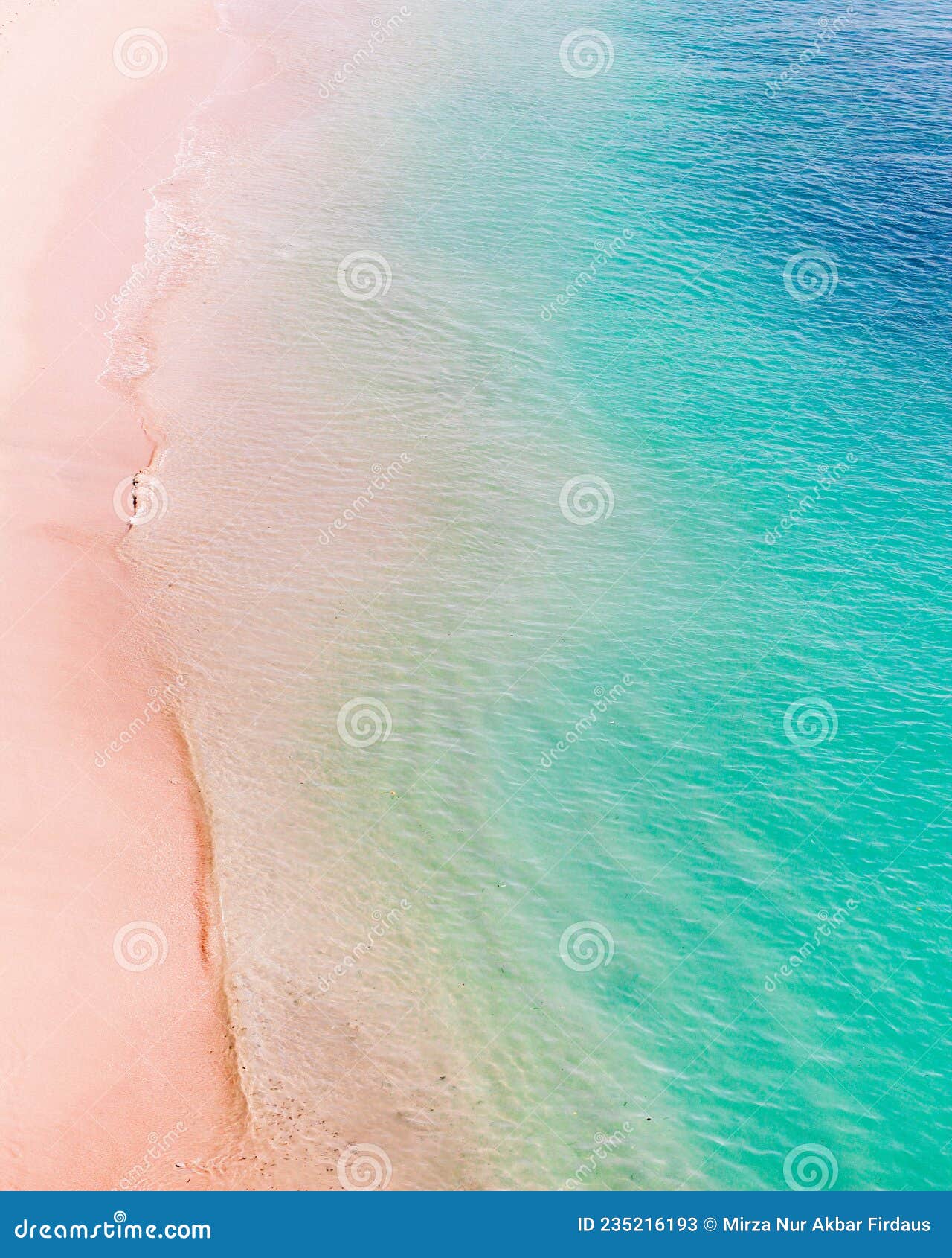 beautiful pink sand beach and blue ocean in indonesia
