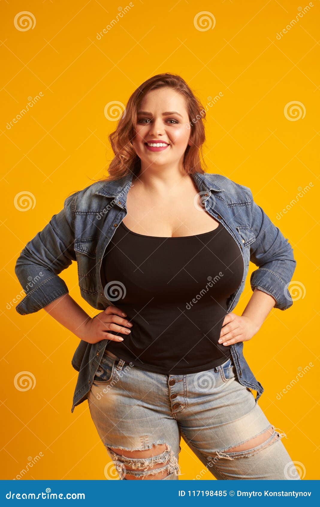 Beautiful Plus-size Model with Big Breast Smiling at Camera Stock