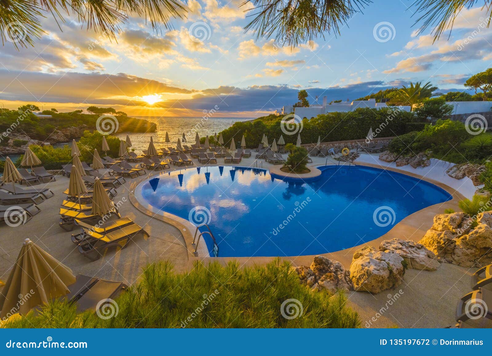 beautiful pool in cala dor at sunset time, palma mallorca island, spain