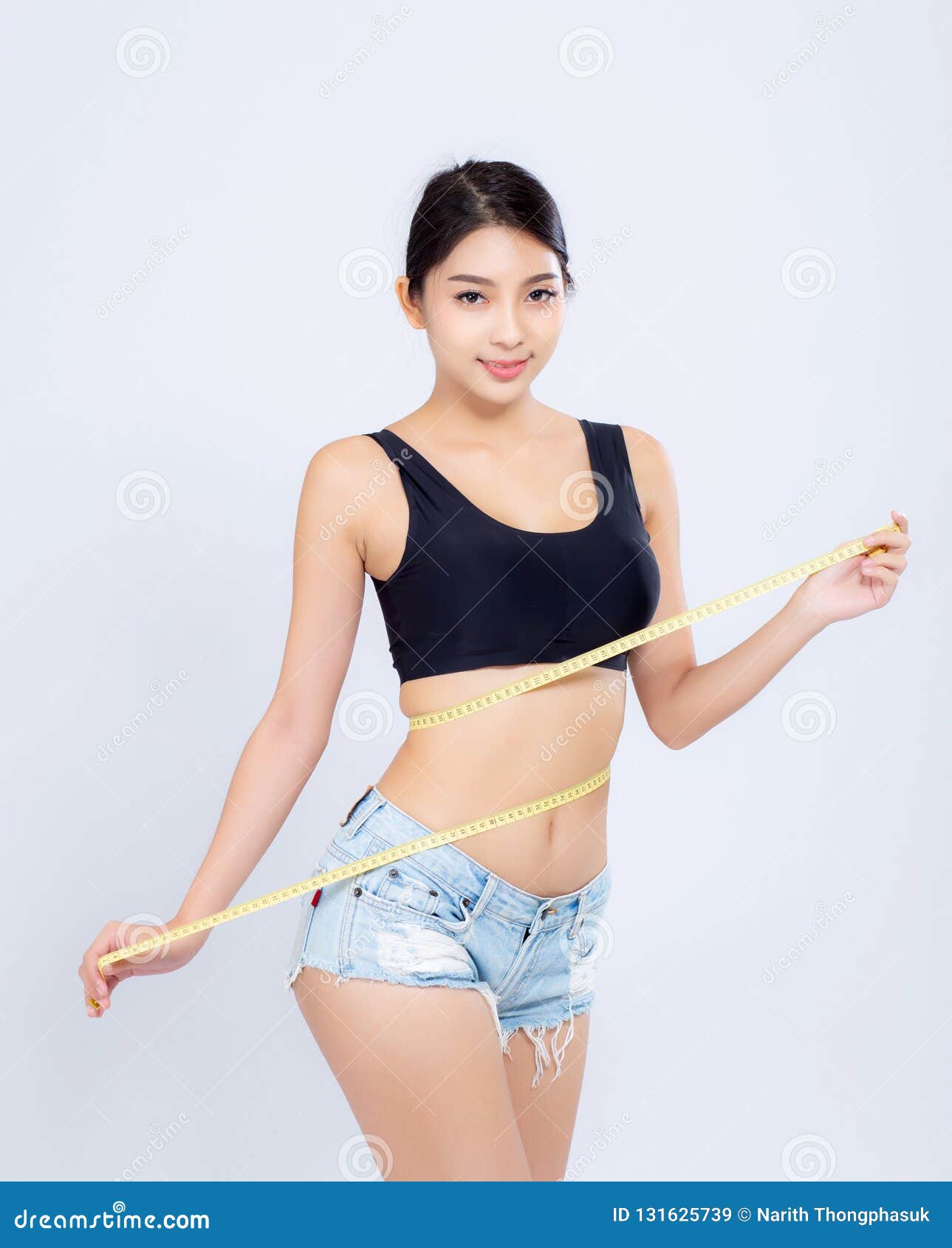 Closeup beautiful young asian woman sexy body slim measuring