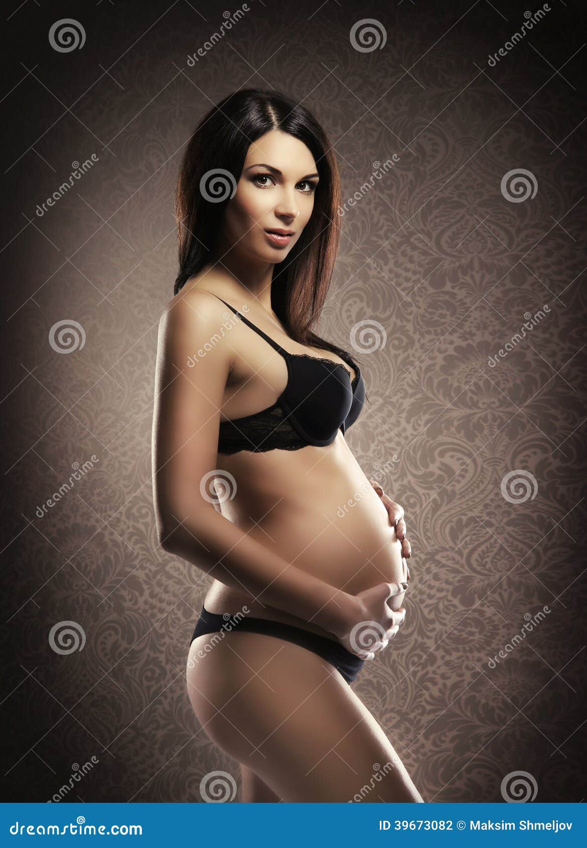 Photo about Glamour portrait of the young and beautiful pregnant woman in l...