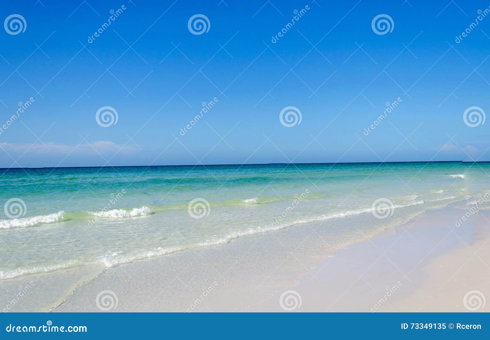 beautiful pristine beach surrounded by blue sky