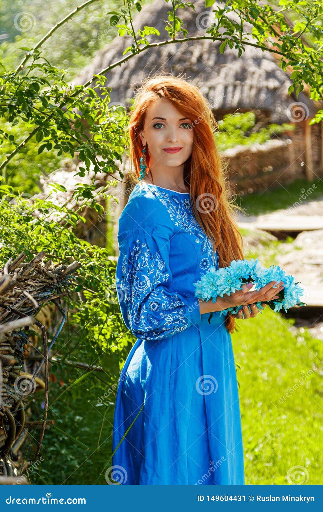 Beautiful Red-haired Girl In A Blue Dress Ukrainian With A Wreath On ...