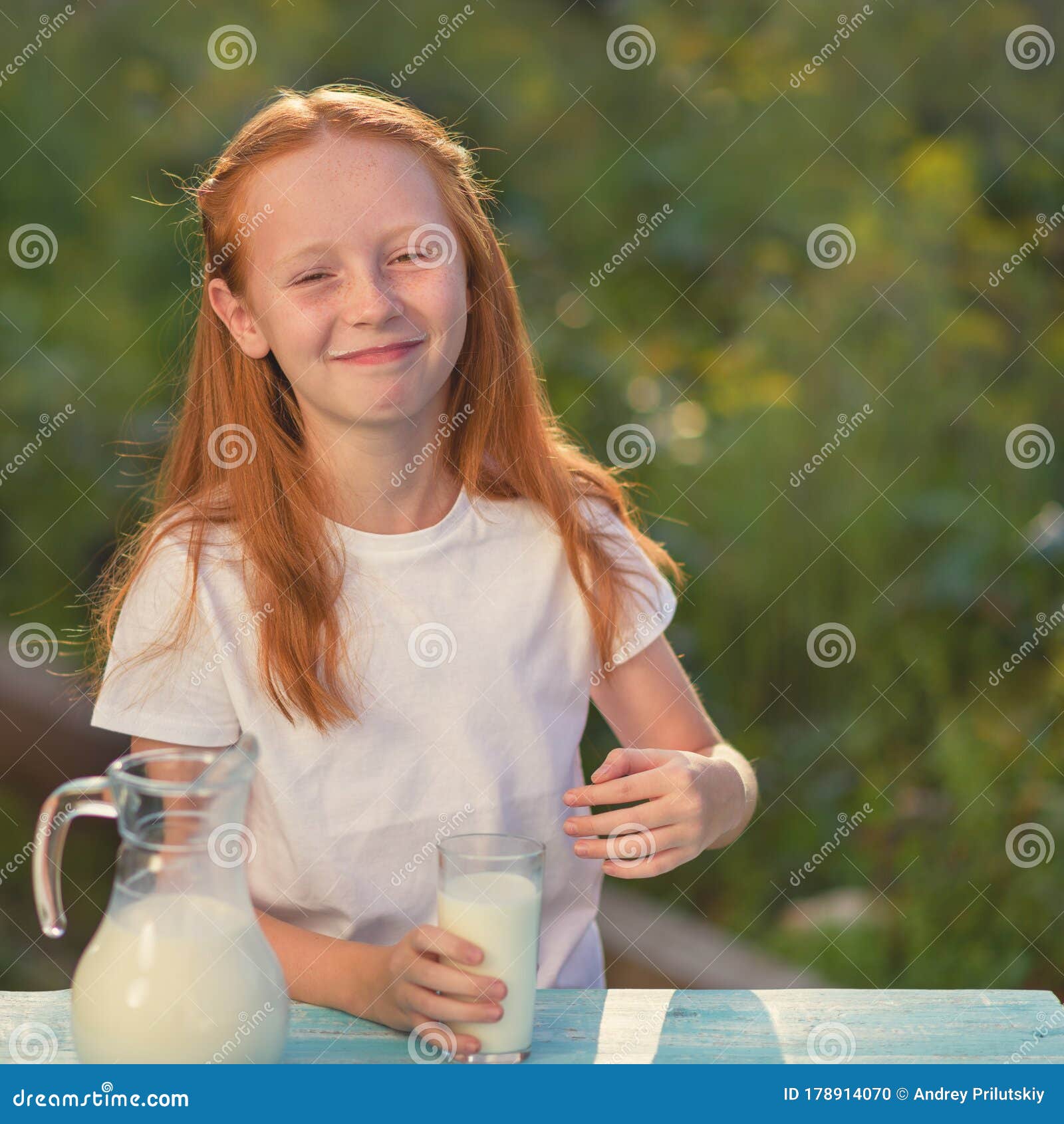 Beautiful Red-haired Girl with Long Hair Drinks Milk and Smiles. Drinking  Milk is Good for Health Stock Photo - Image of portrait, drinks: 178914070