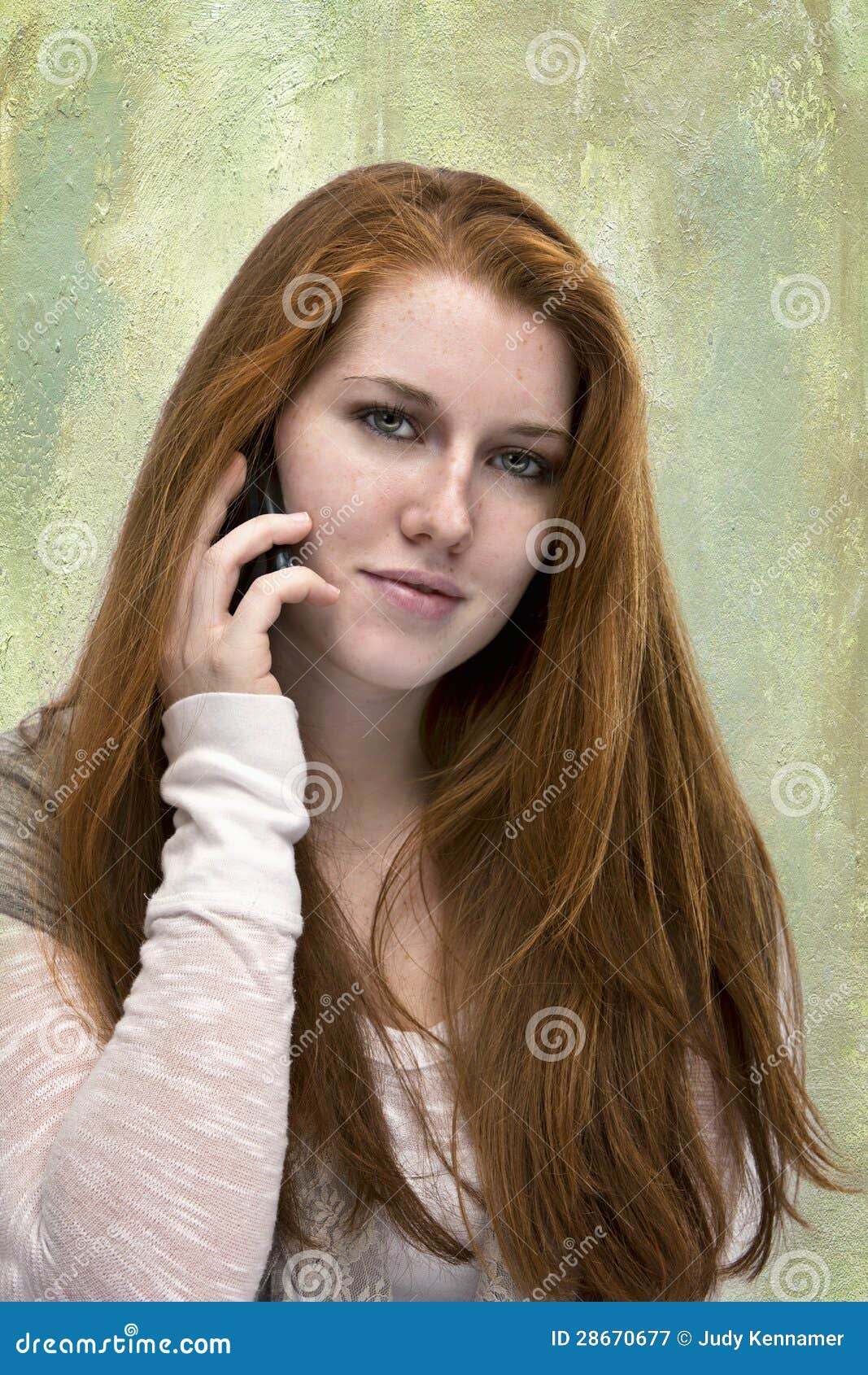 Beautiful Red Haired Teen With Phone Stock Image I