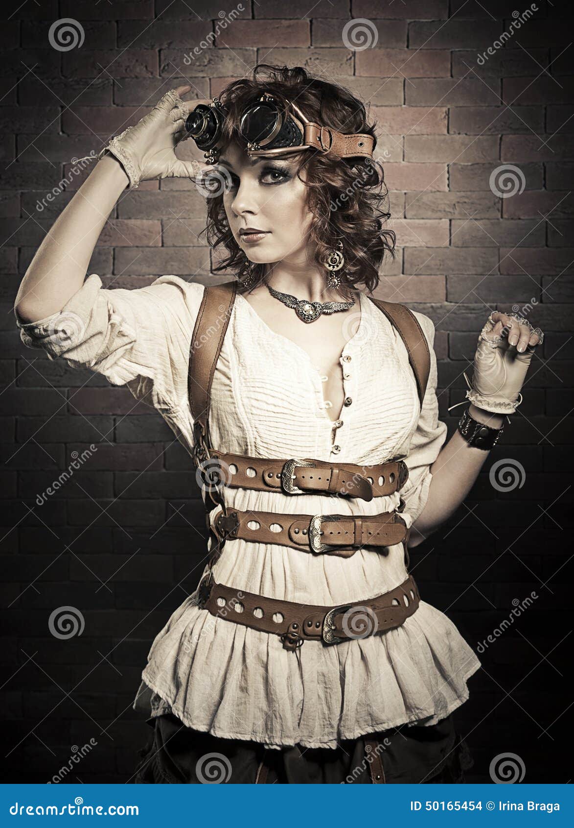 beautiful redhair woman with steampunk goggles . old-fashioned.